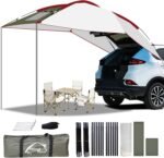 Copertină extensibilă pentru hayon, montată pe SUV, oferind spațiu umbrit pentru camping sau picnic