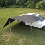Copertină auto fixă Dulepax montată pe SUV, cu tije telescopice și ventuze, ideală pentru camping, picnic sau umbră laterală la mașină.